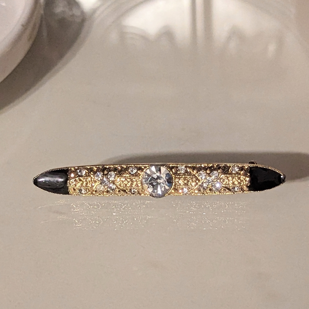 1928 Brand Rhinestones Set in Gold-toned Brooch w/ Black Enamel